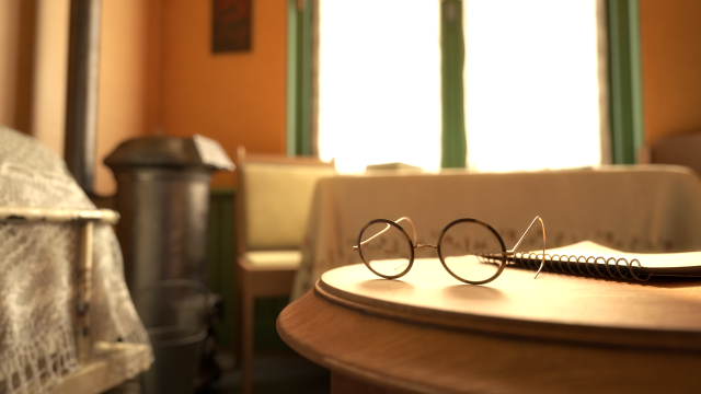 A cinematic close-up of some glasses on a table.